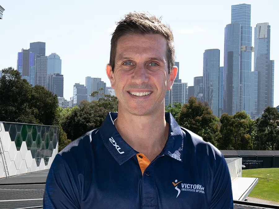 A headshot of a Caucasian man in his forties with short brown hair.