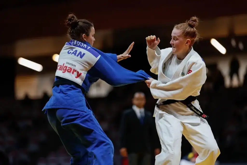 Victorian Institute of Sport Judo athlete Ryley Rametta flighting in a competition in a blue judogi.