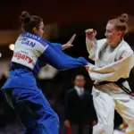 Victorian Institute of Sport Judo athlete Ryley Rametta flighting in a competition in a blue judogi.
