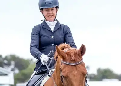 Kelly Ffrost, Para Dressage athlete, riding a chestnut coloured horse