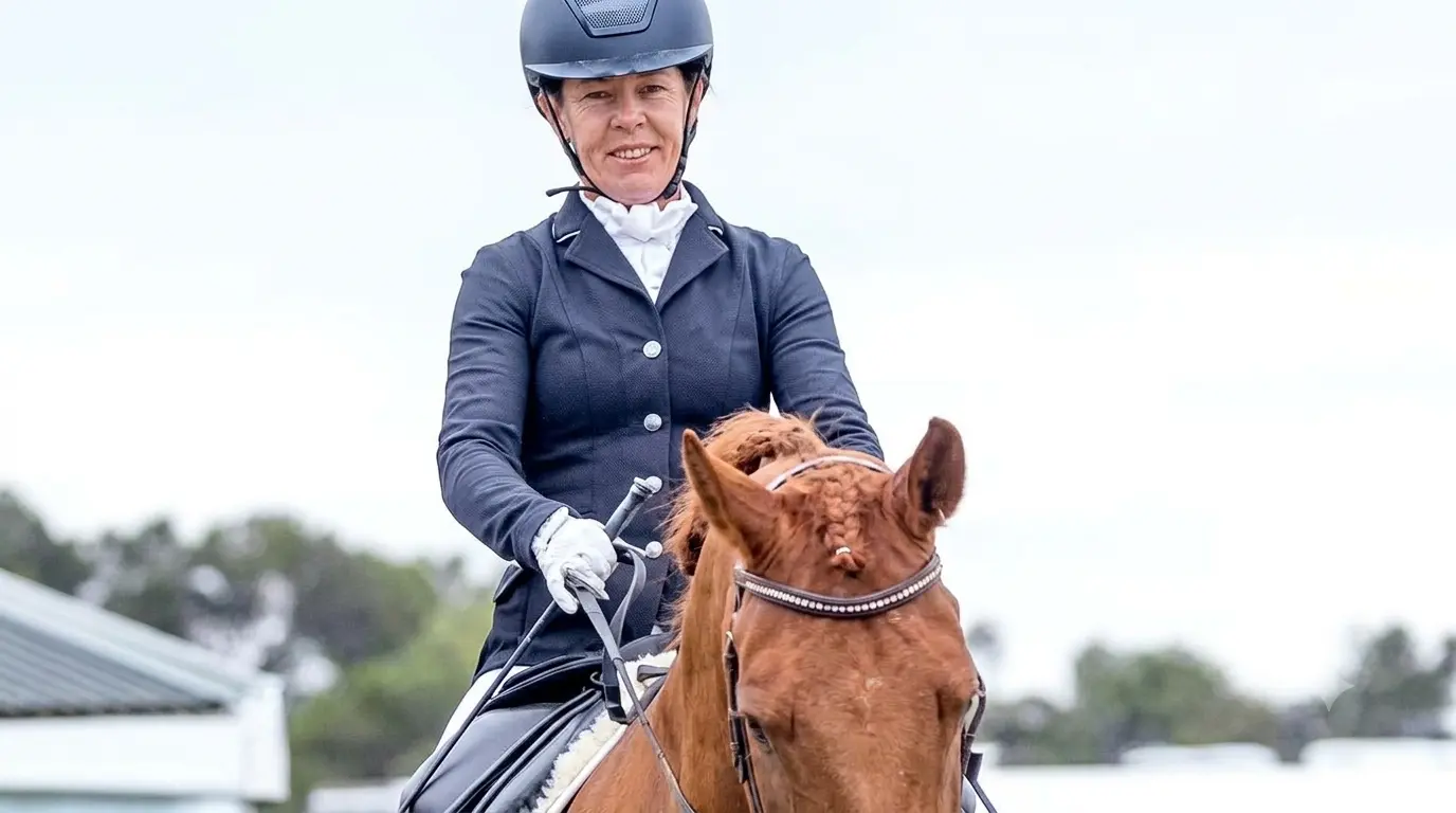 Kelly Ffrost, Para Dressage athlete, riding a chestnut coloured horse