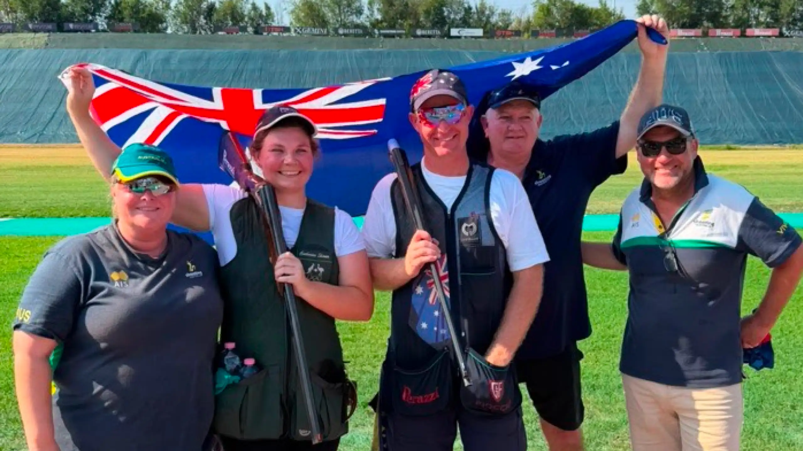 Team Australia celebrating by holding up Australian Flag and smiling at the ISSF Shotgun World Cip 2026